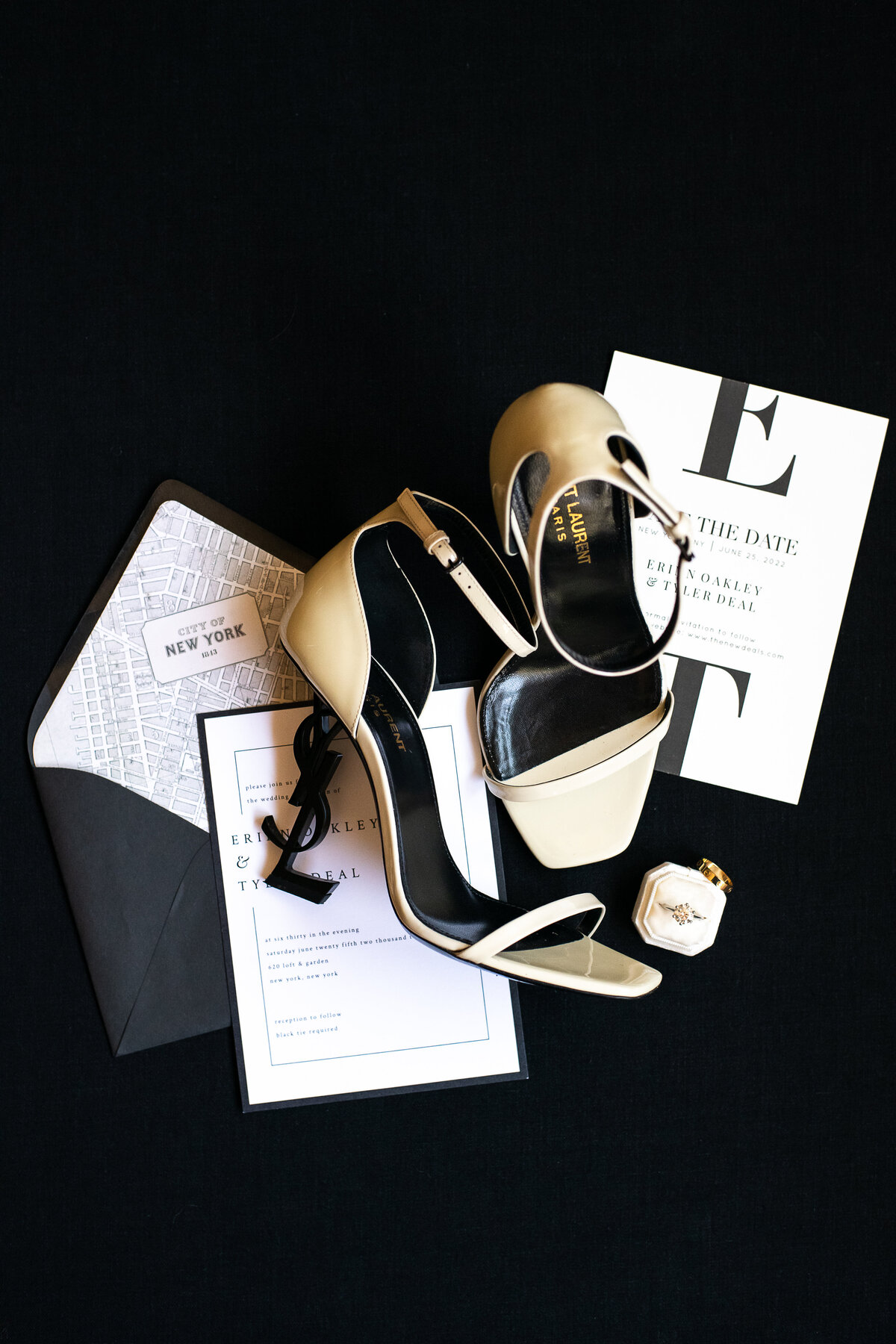 White strappy YSL heels bridal shoes and modern black and white wedding invitation
