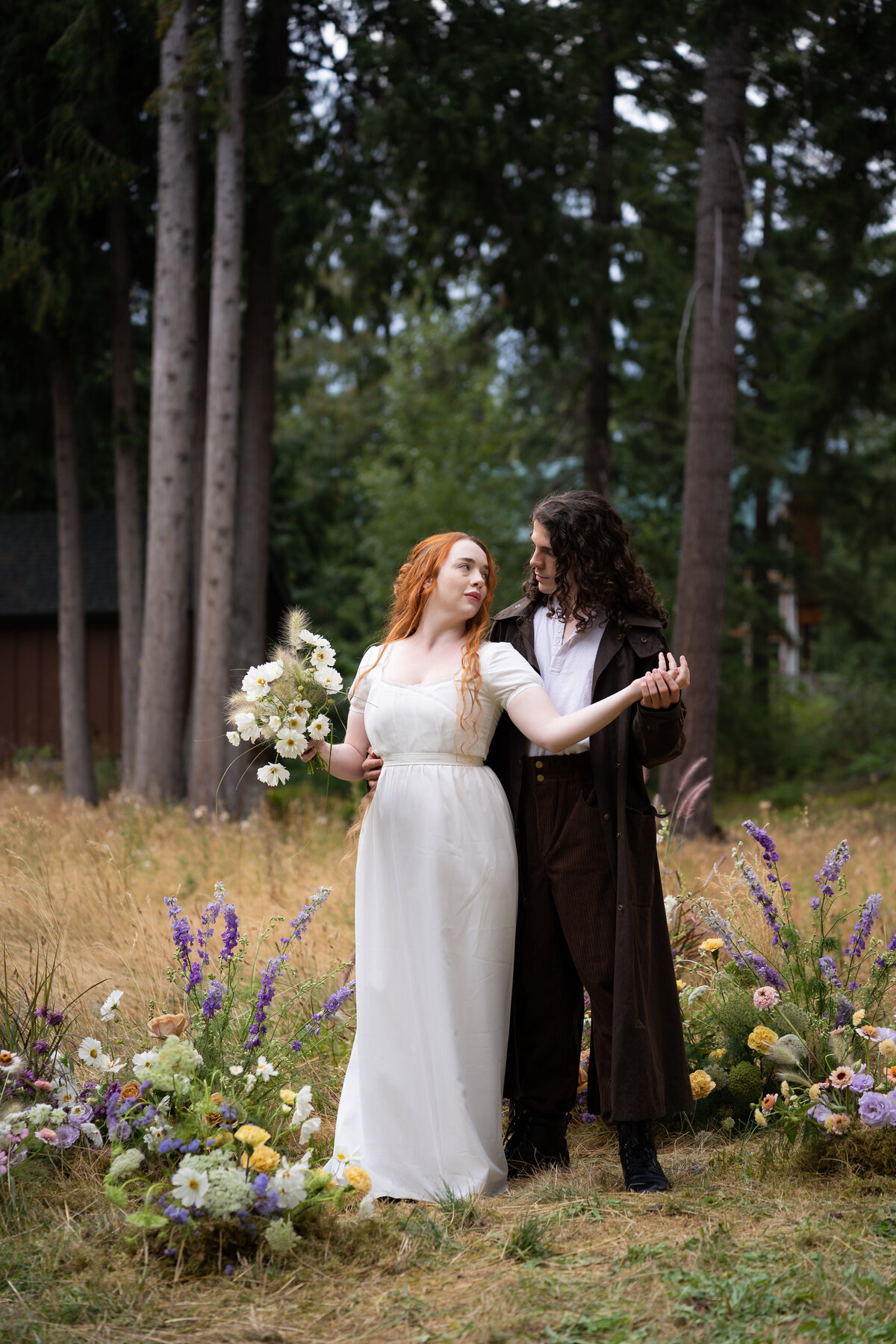 A couple dancing in a forest