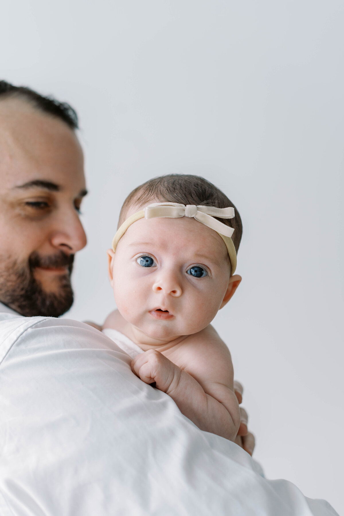 father holding newborn