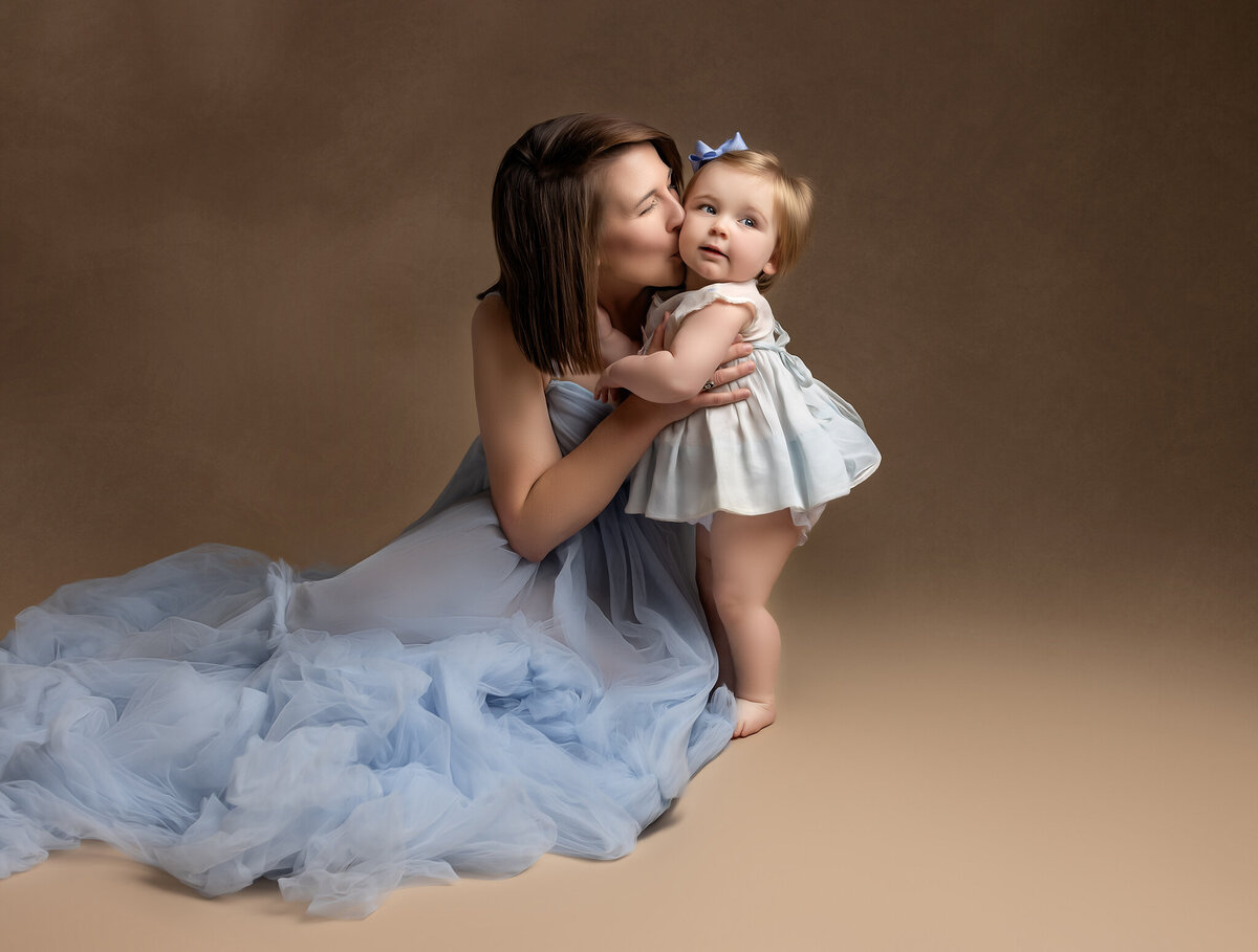 Mother and daughter in blue dress