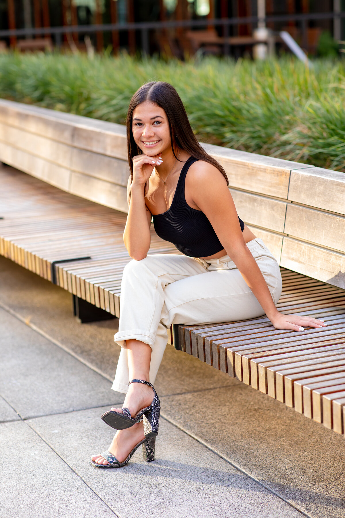 Senior girl sitting on wood bench Seattle WA