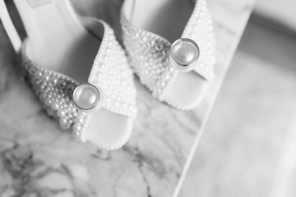 Jimmy Choo bridal shoes covered with white pearl at the destination wedding in Lake Como