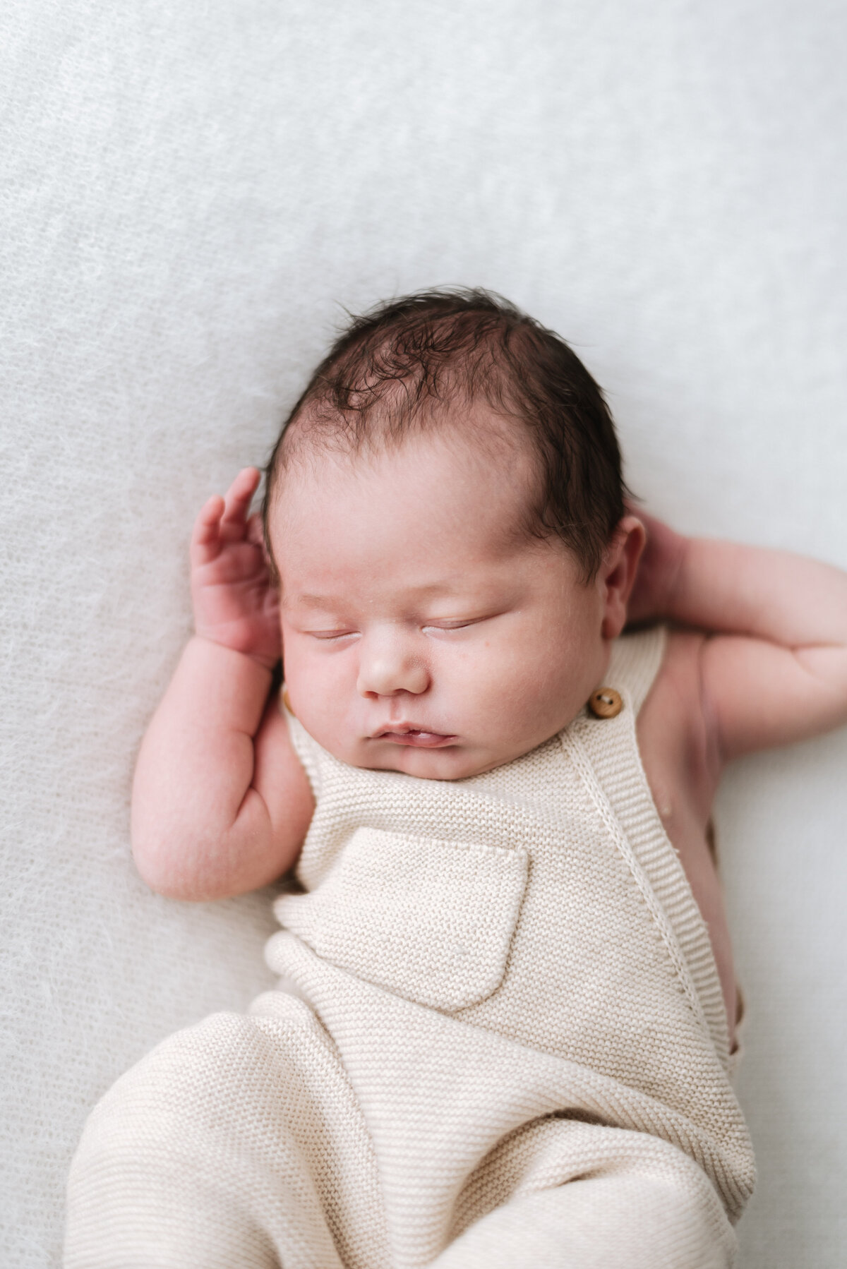 Newborn baby boy sleeping at billingshurst newborn photoshoot