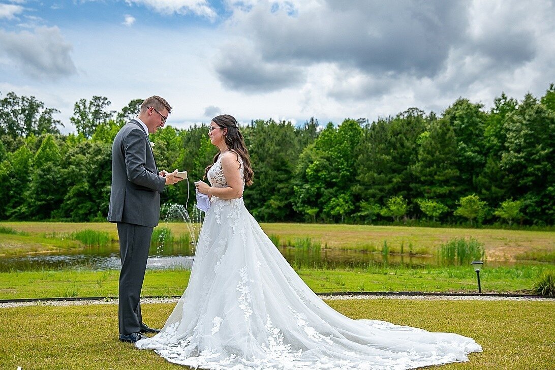 Bride-Groom-White-Wedding-Dress-Veranda-Fountain-The-Legacy-at-Willow-Pond.JPG