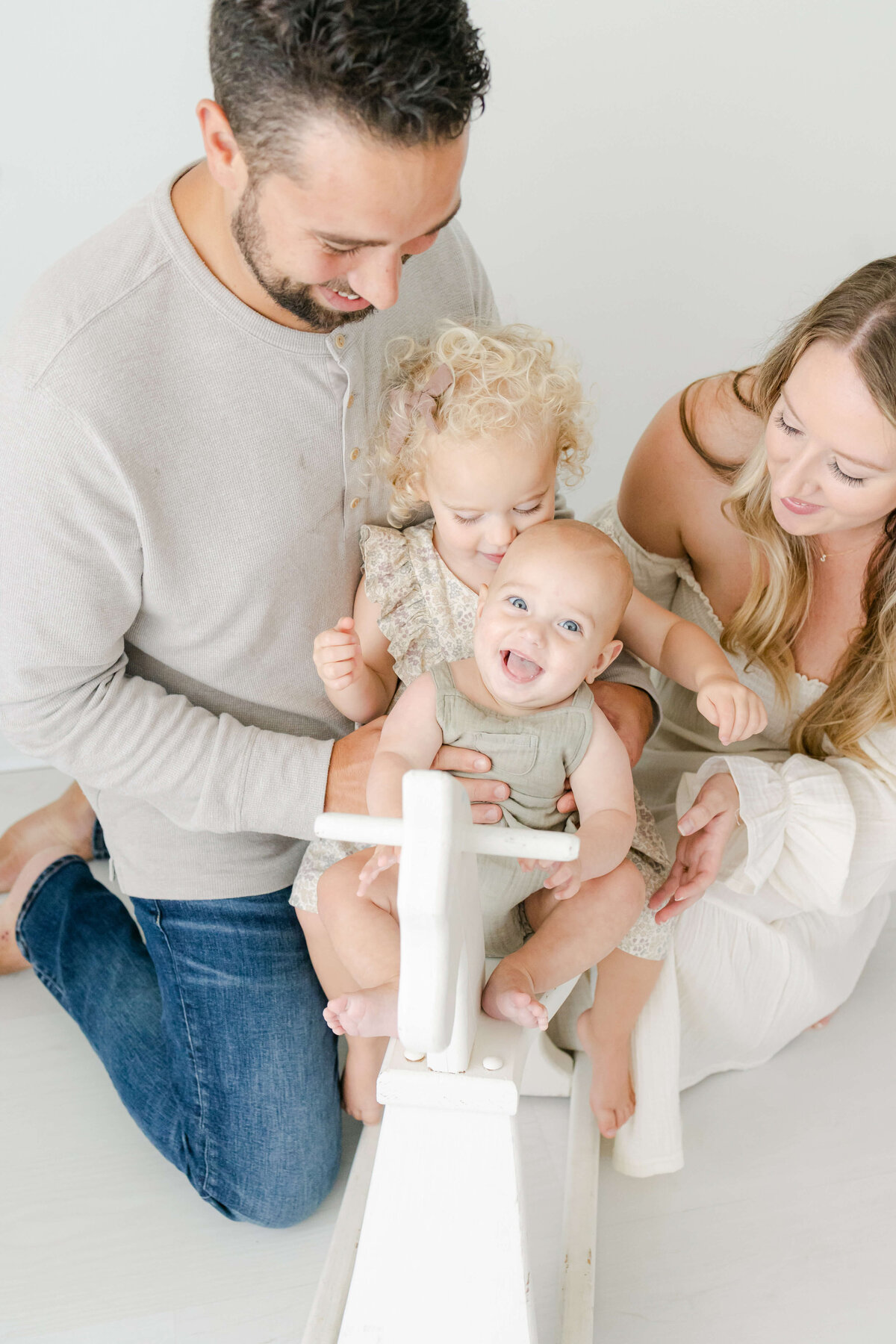 parents playing with their two kids