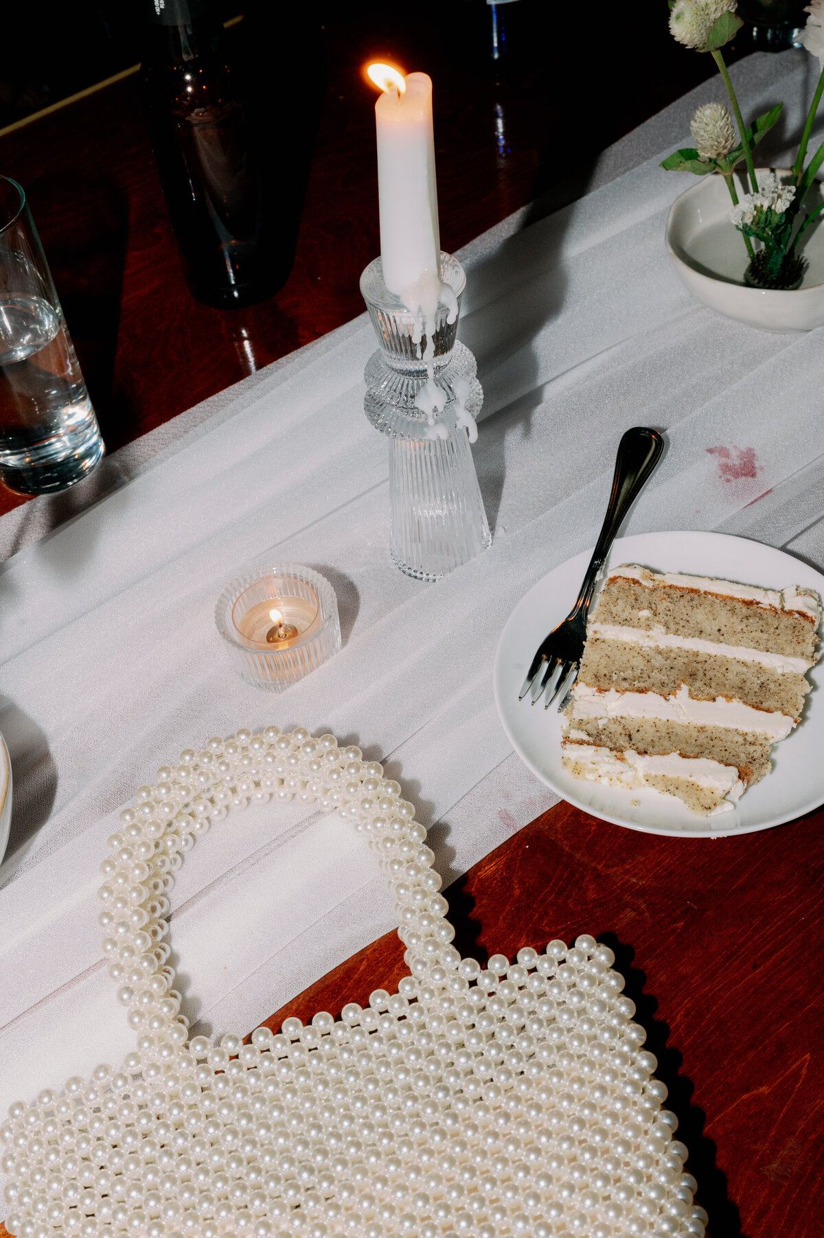 purse and cake on table