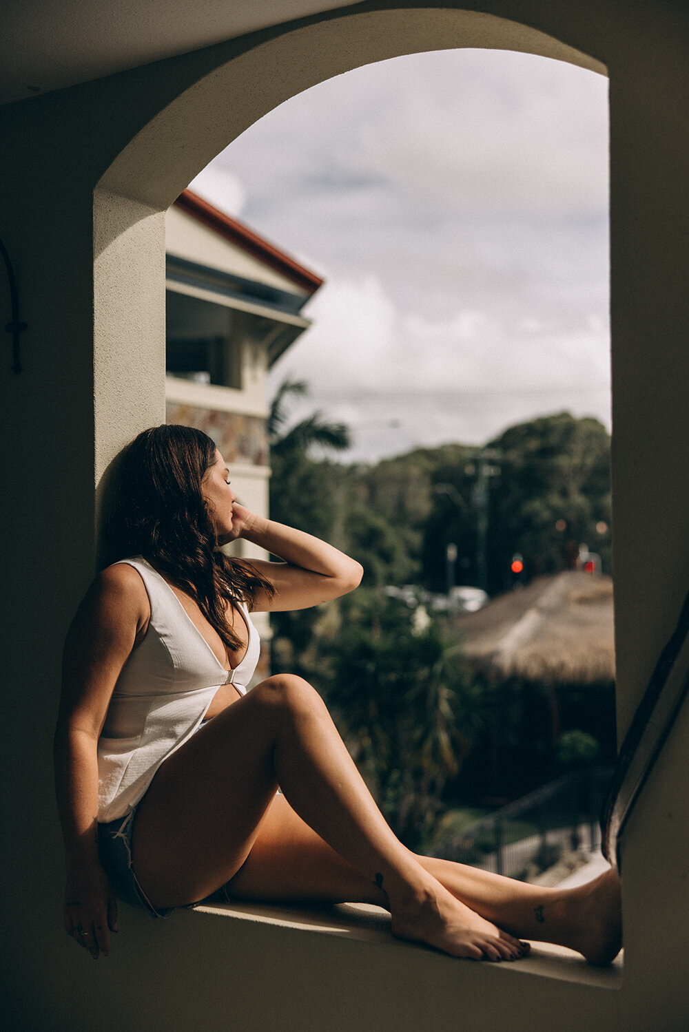 A dreamy personal branding shot of a woman gazing into the distance, photographed by a Sunshine Coast branding photographer in soft natural light.