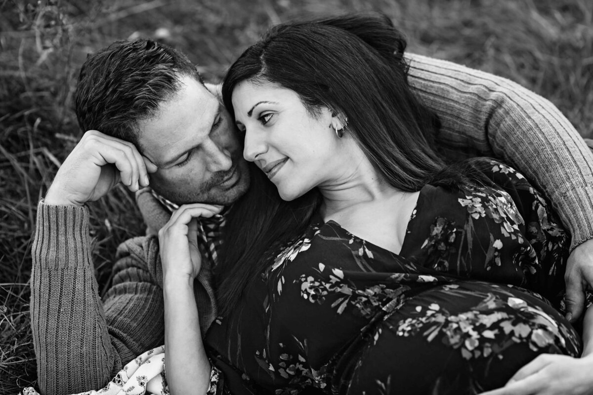 london ontario maternity photography couple laying in grass