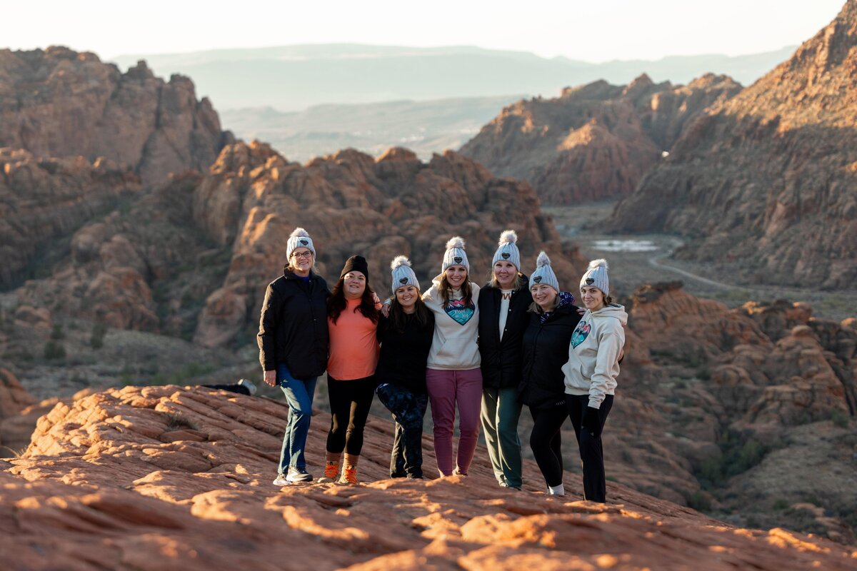 group shot of women standing on mountain