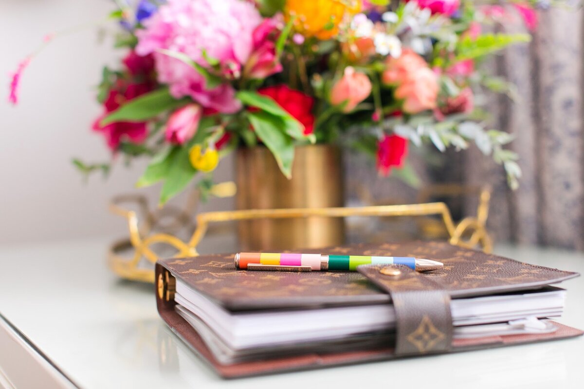 notebook and colorful bouquet