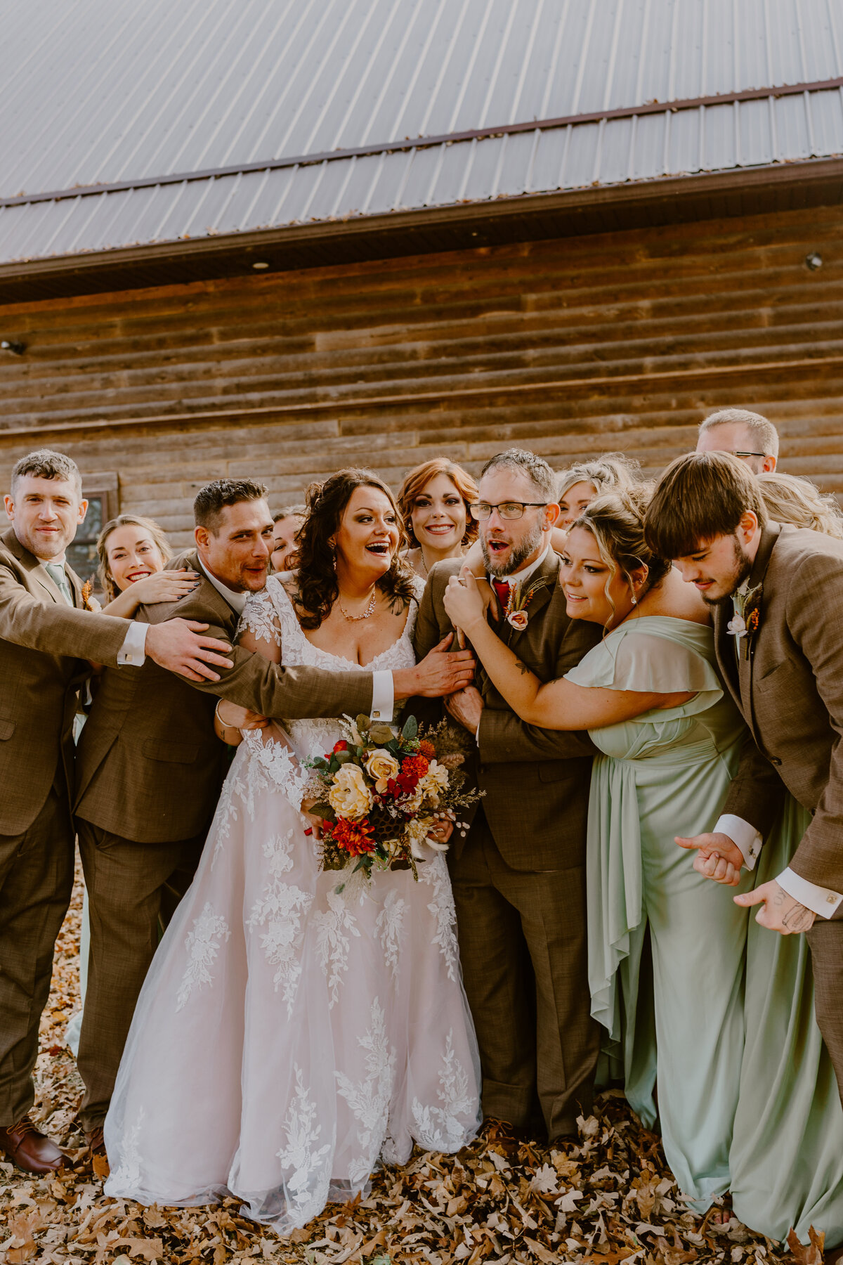 storyteller-collective-photo-co-wedding-party-group-hug-iowa