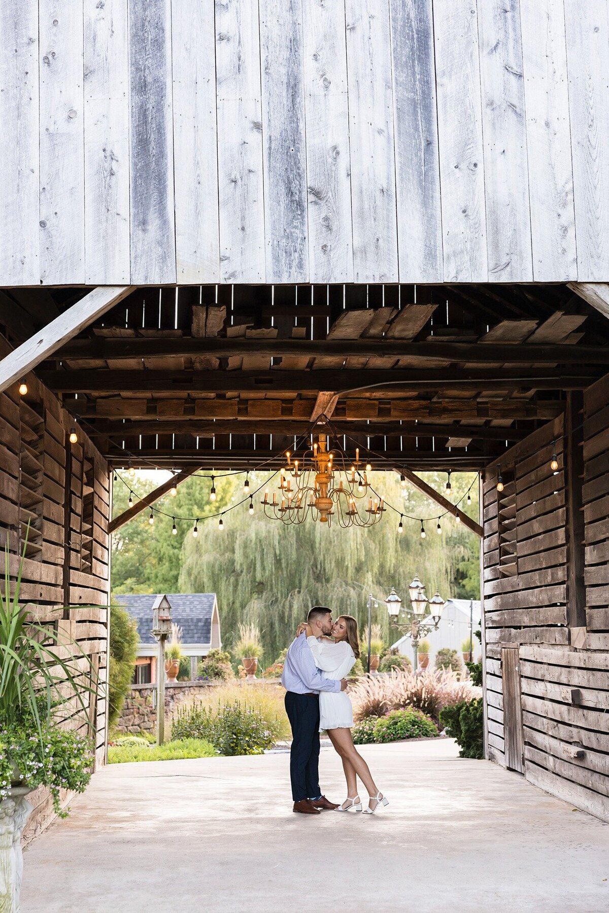 engaged-couple-embracing-historic-acres