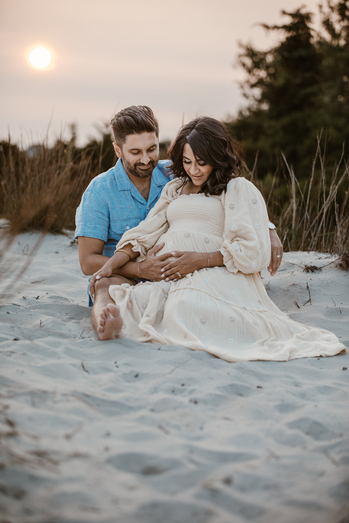 natural beach maternity shoot of couple together
