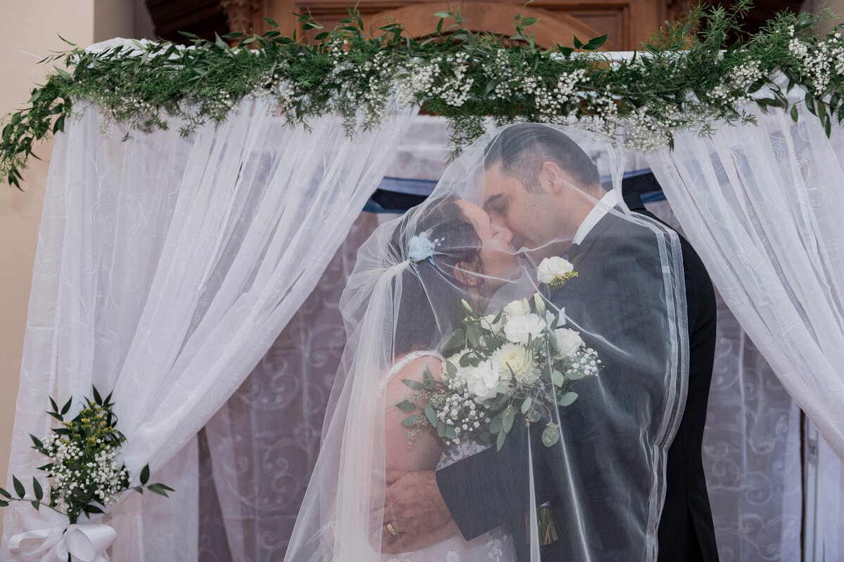Couple dancing at outdoor wedding celebration