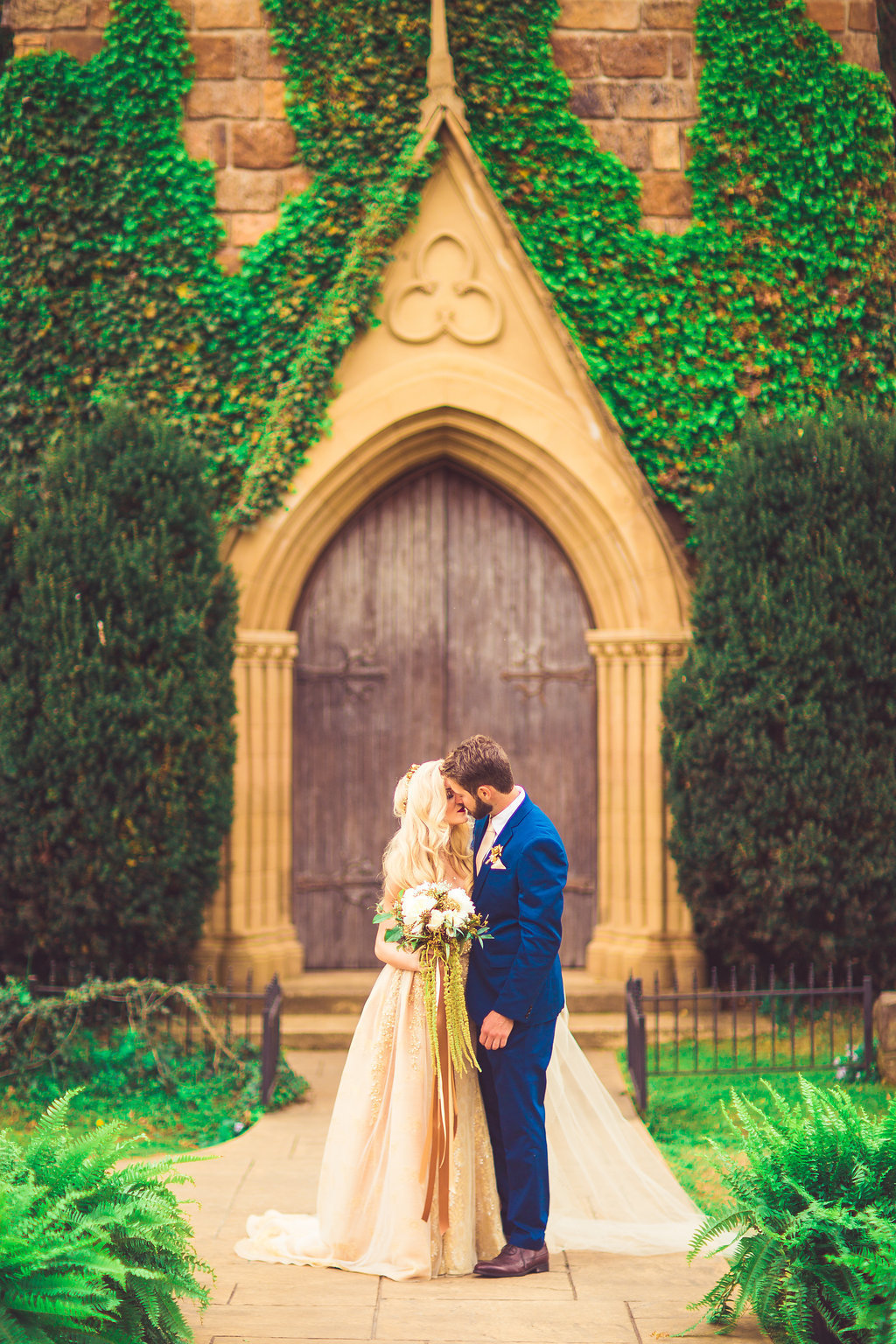 Wedding Photograph Of Bride and Groom Kissing with Bouquet of Flowers Los Angeles