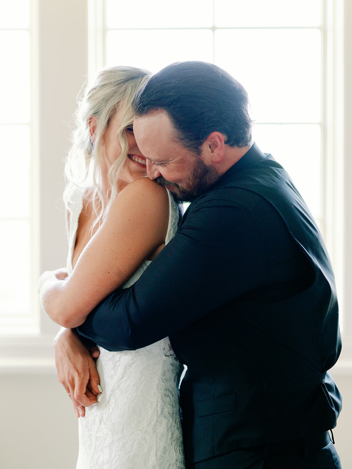 Bride and groom share an intimate moment as they embrace eachother