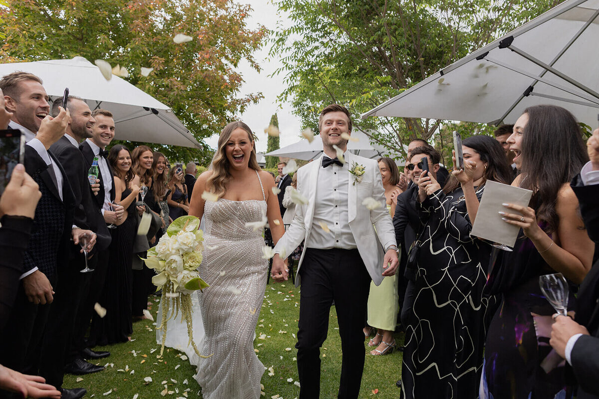 Couple exit their ceremony after getting married 