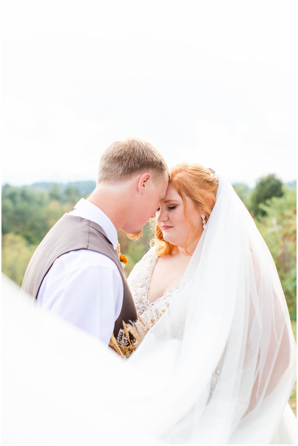 romantic groom and bride foreheads touching in outdoor NC wedding – Asheville NC Wedding Photographer | Tracy Waldrop