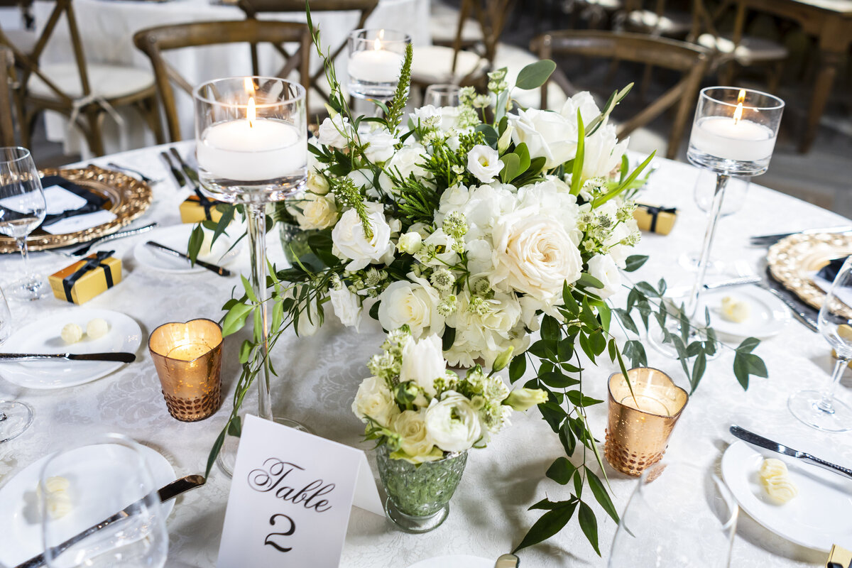 Table setting with bouquet in the center.