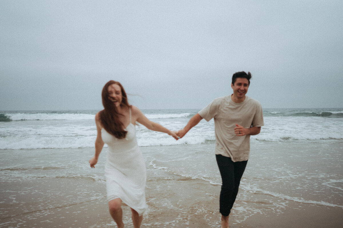 couple shoot for maternity session during golden hour Oregon coast beach wedding/elopement - photographed by The Storytellers