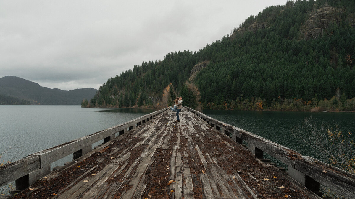 Couple on a trestle bridge in Campbell River during their engagement session by latitude 49 photography