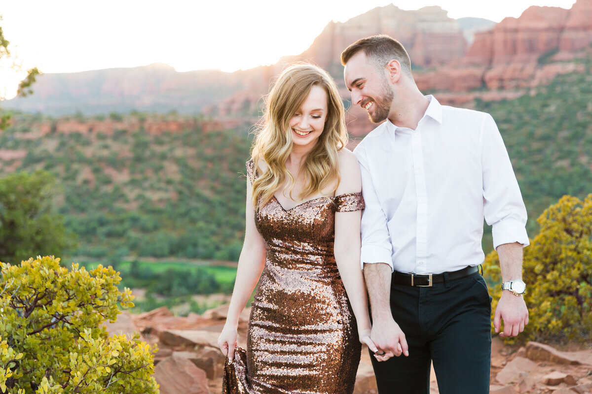 engaged couple walking together in Sedona Arizona
