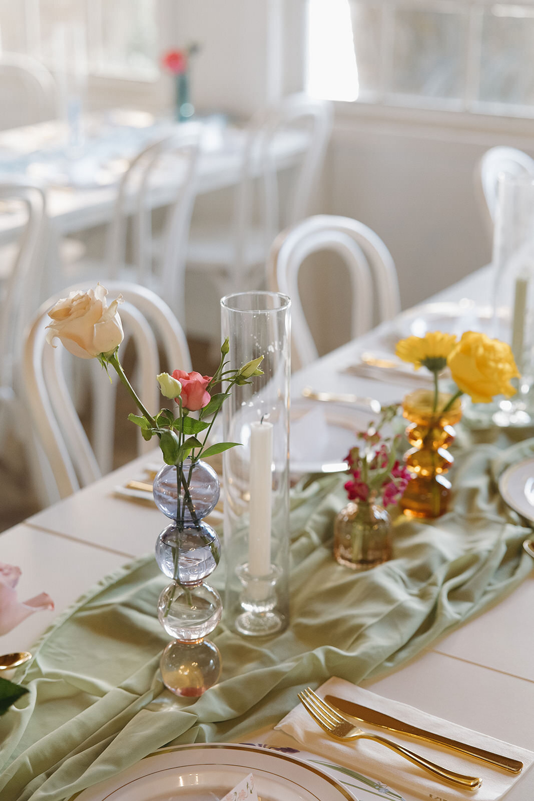  Spring-inspired wedding table setup with pastel florals and elegant place settings at Uliana Estate in Lakeland FL.

