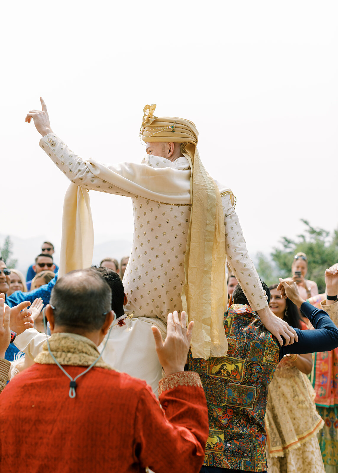 Groom being carried at a South Asian Fusion wedding