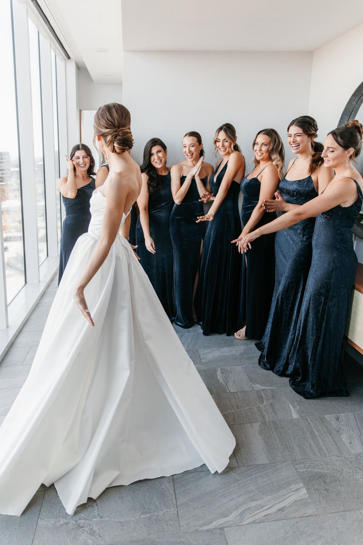 Bridesmaids first look with bride after getting ready in the Four Seasons hotel in Nashville TN