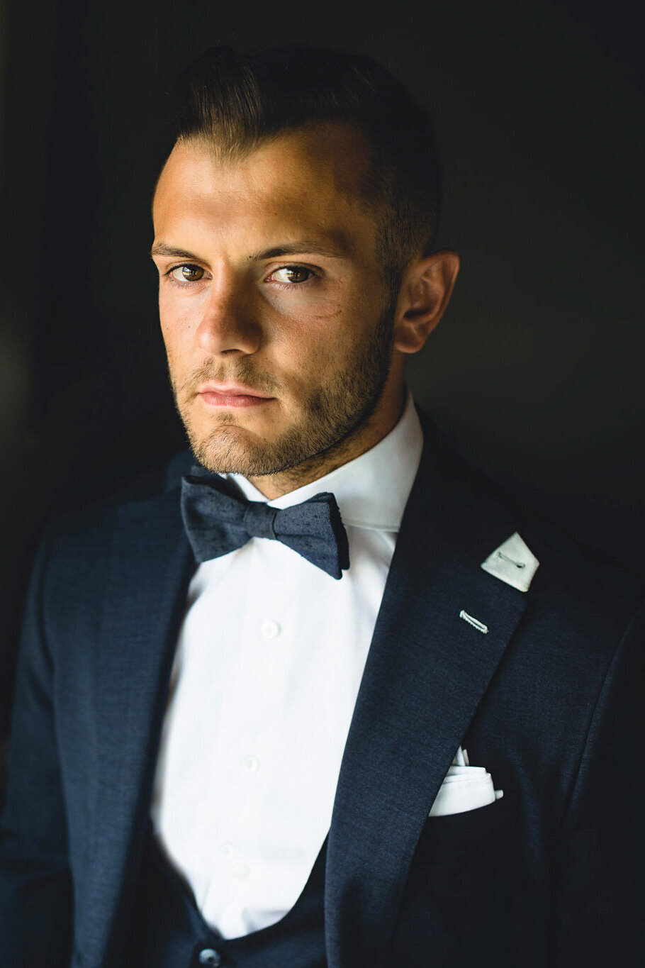 a portrait wedding photo of jack wilshere at his wedding