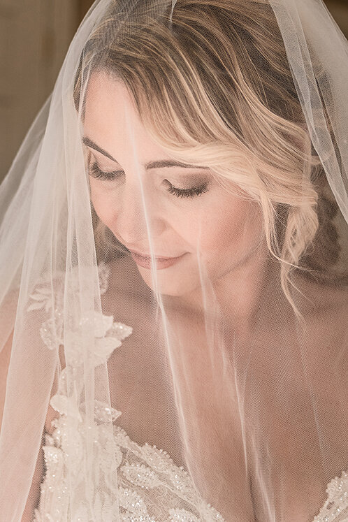 Beautiful bridal portrait with vail covering face at Wentworth Inn in Jackson NH by Lisa Smith Photography