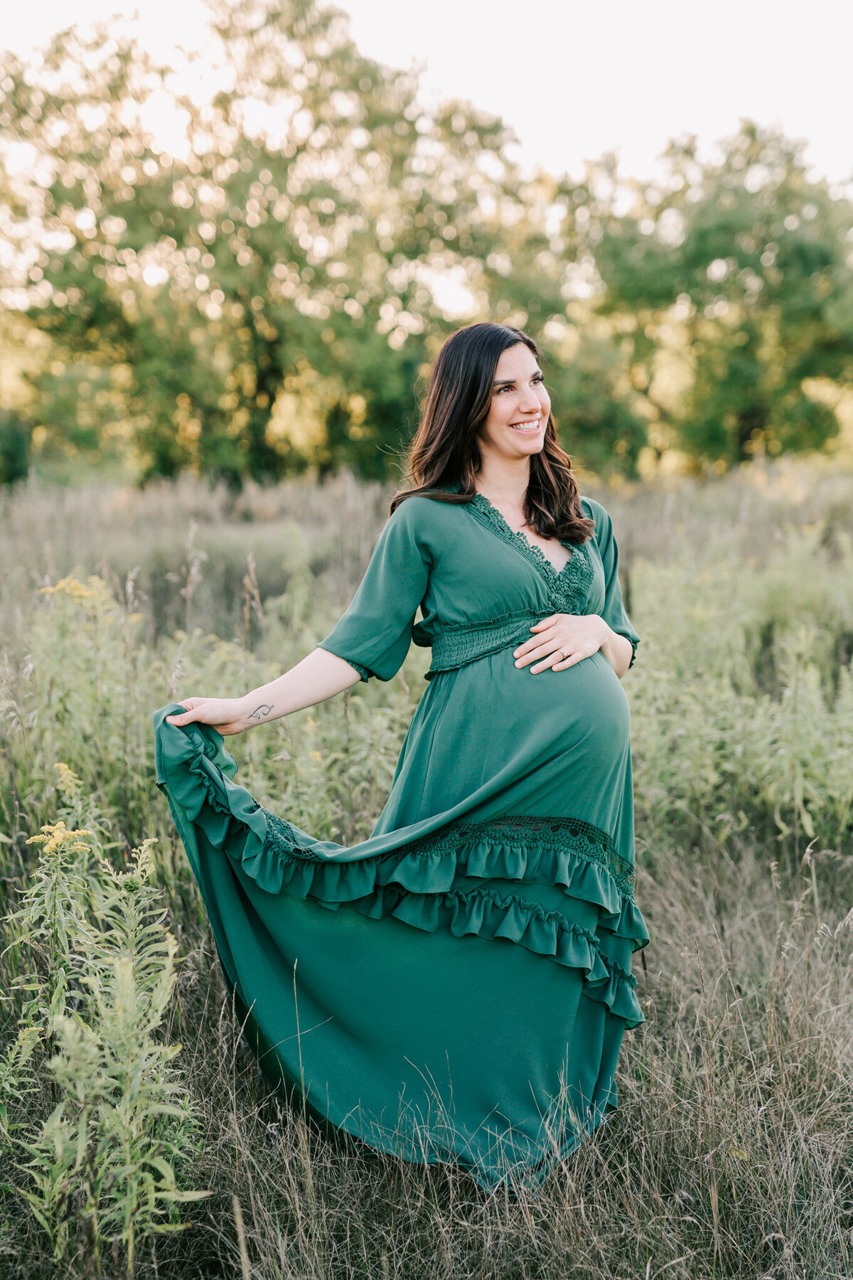 The Toronto Maternity Photographer Chelsey Kae Photography Photographs a woman in a green baltic born dress.