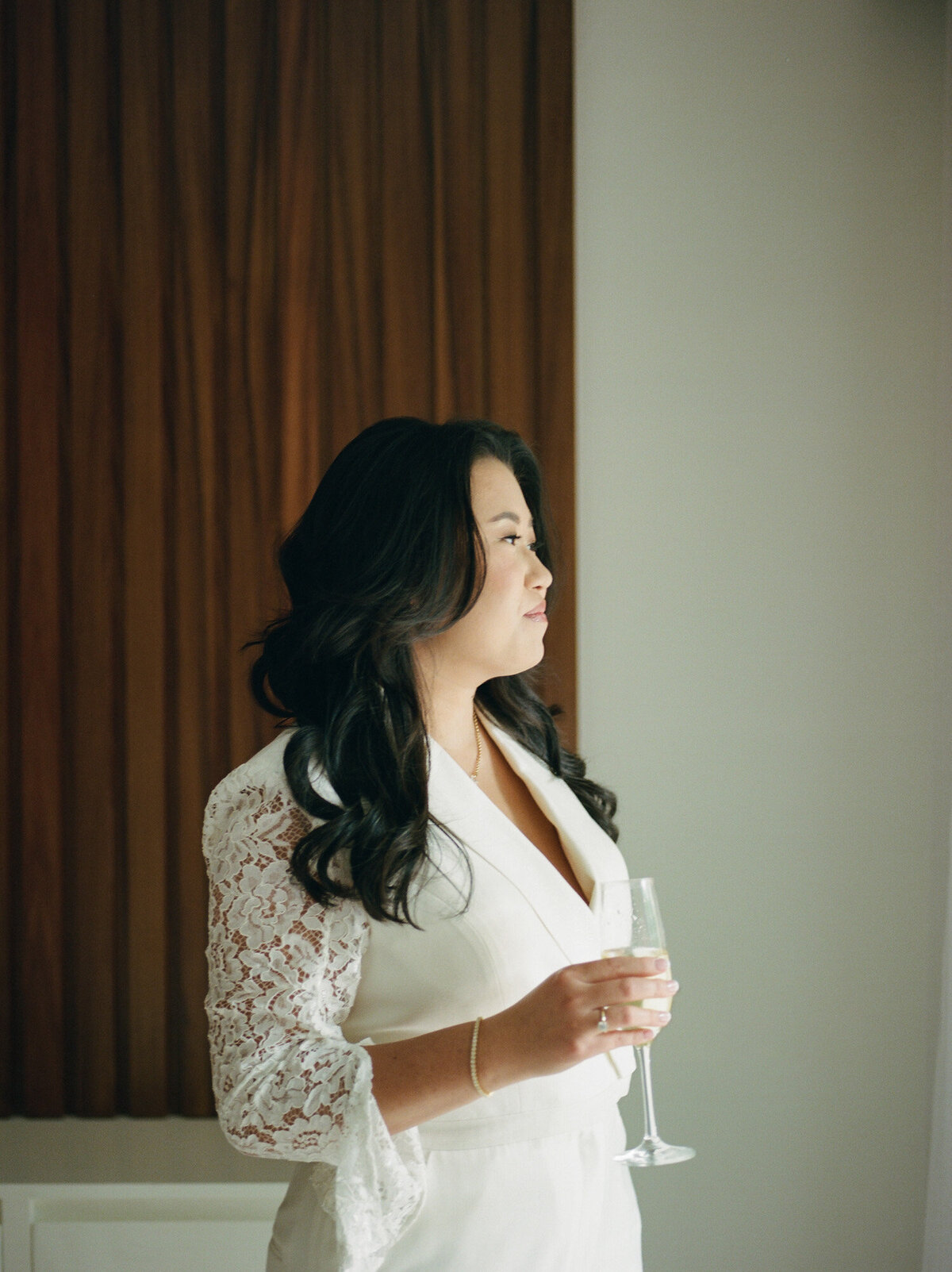 asian bride in chic pantsuit with lace sleeves, Mexico resort wedding