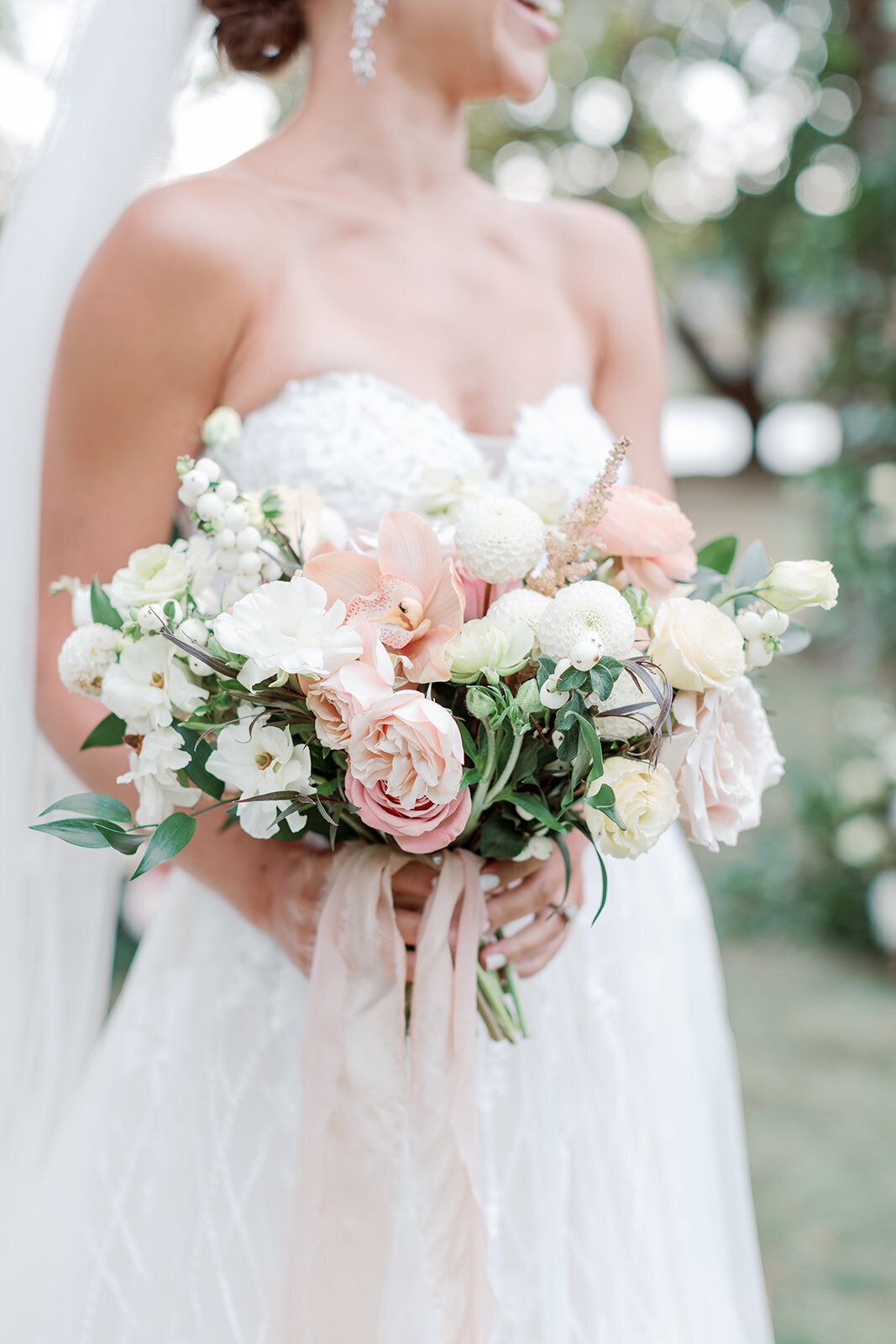 Blush and white bridal bouquet with pink ribbon