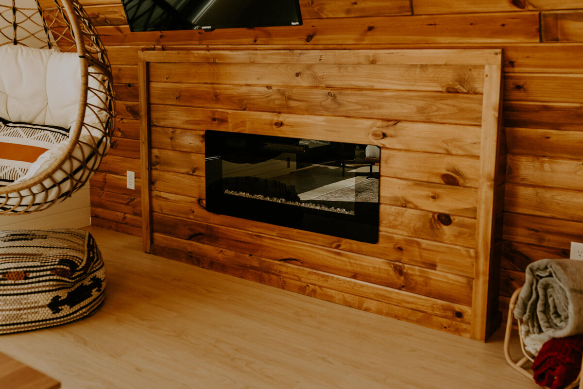 Electric fireplace inside of Minnesota aframe cabin.