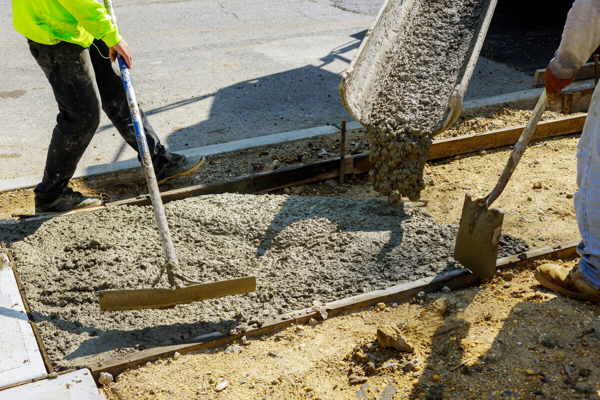 men pouring concrete