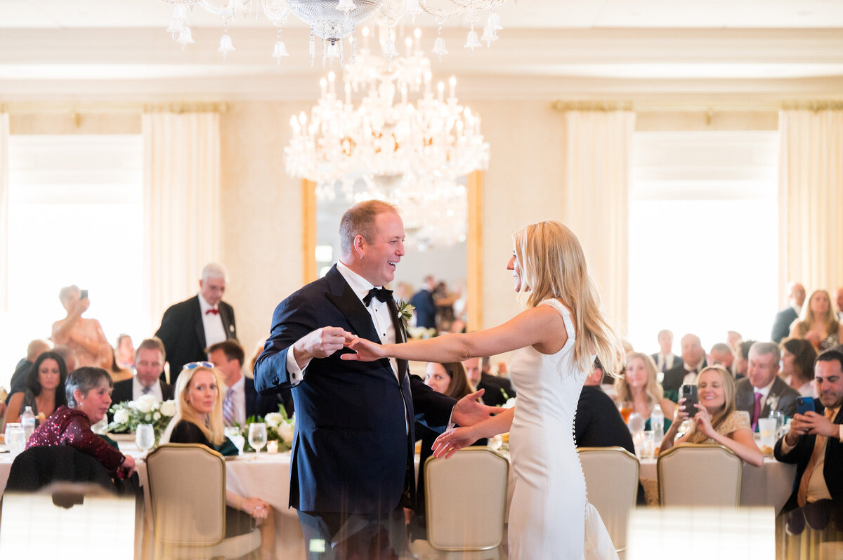 married couple dancing together in the ballroom at the pittsburgh field club on their wedding day