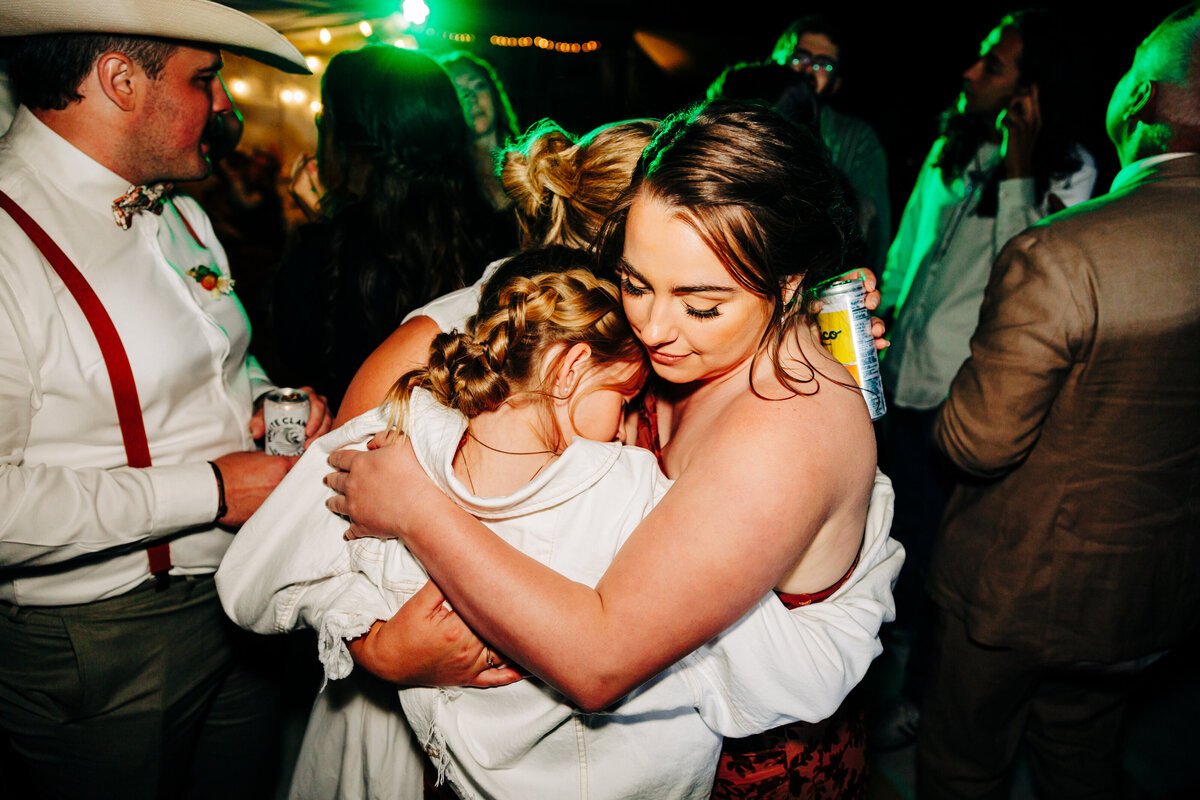 Goodbye hug group huddle at private home wedding in Choteau, MT