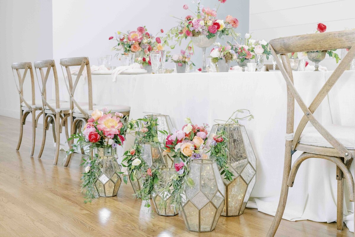 wedding tablescape with florals and lanterns