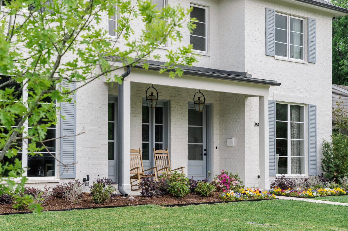White traditional home in Dallas with blue shuttters
