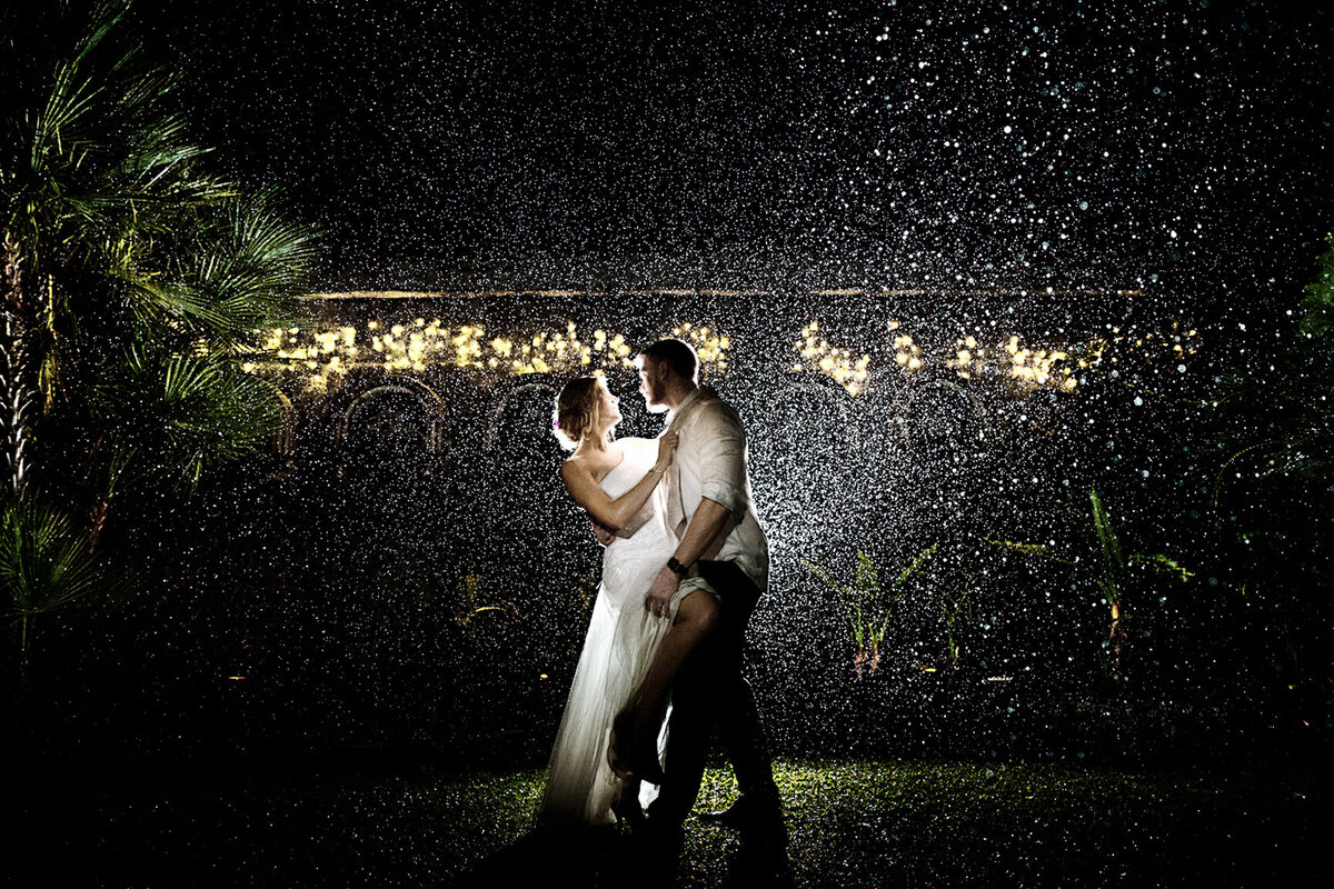 Award-winning sensual bridal photography with flash under rain at the exotic Villa Botanica.