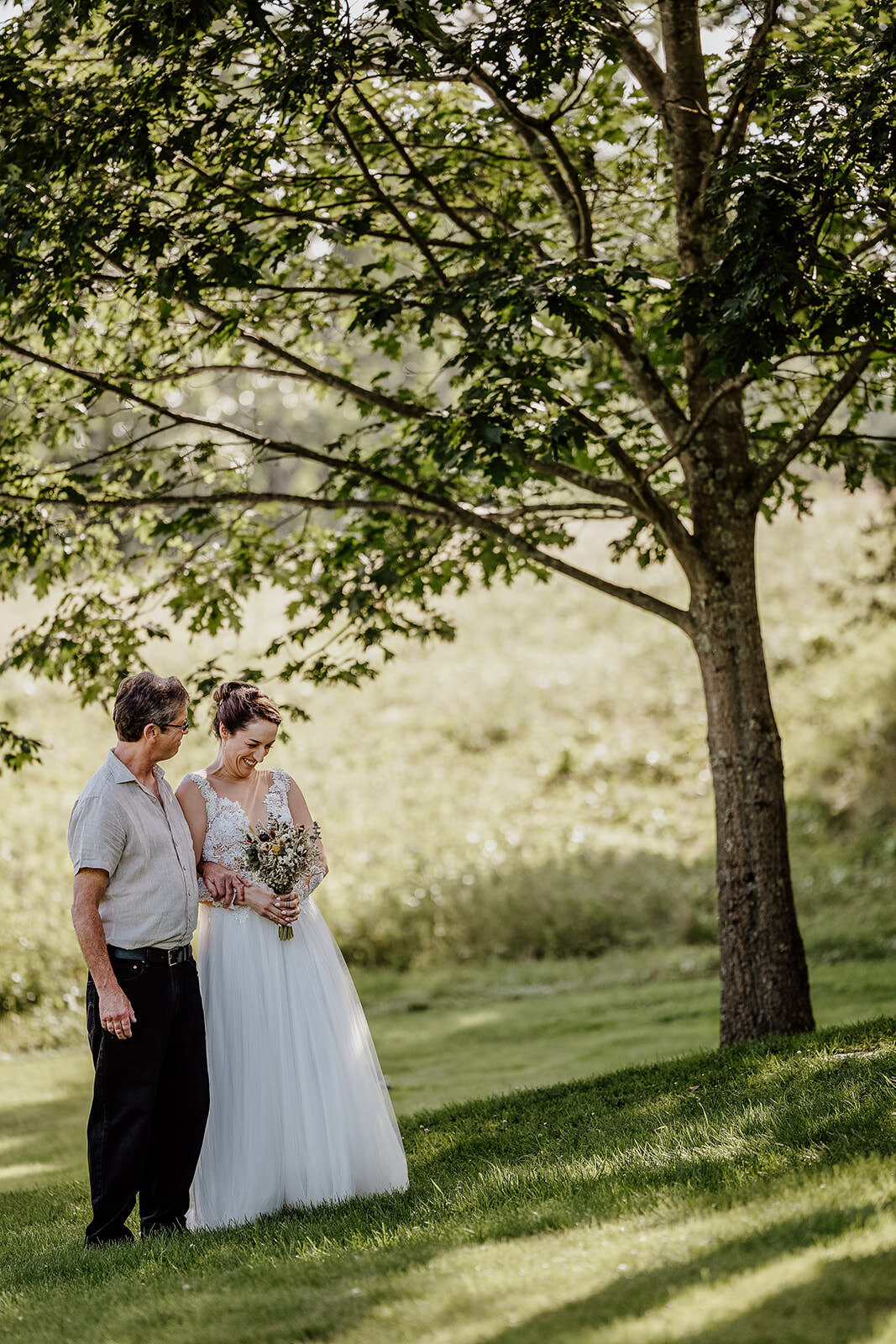 A person walking down the aisle with their parent