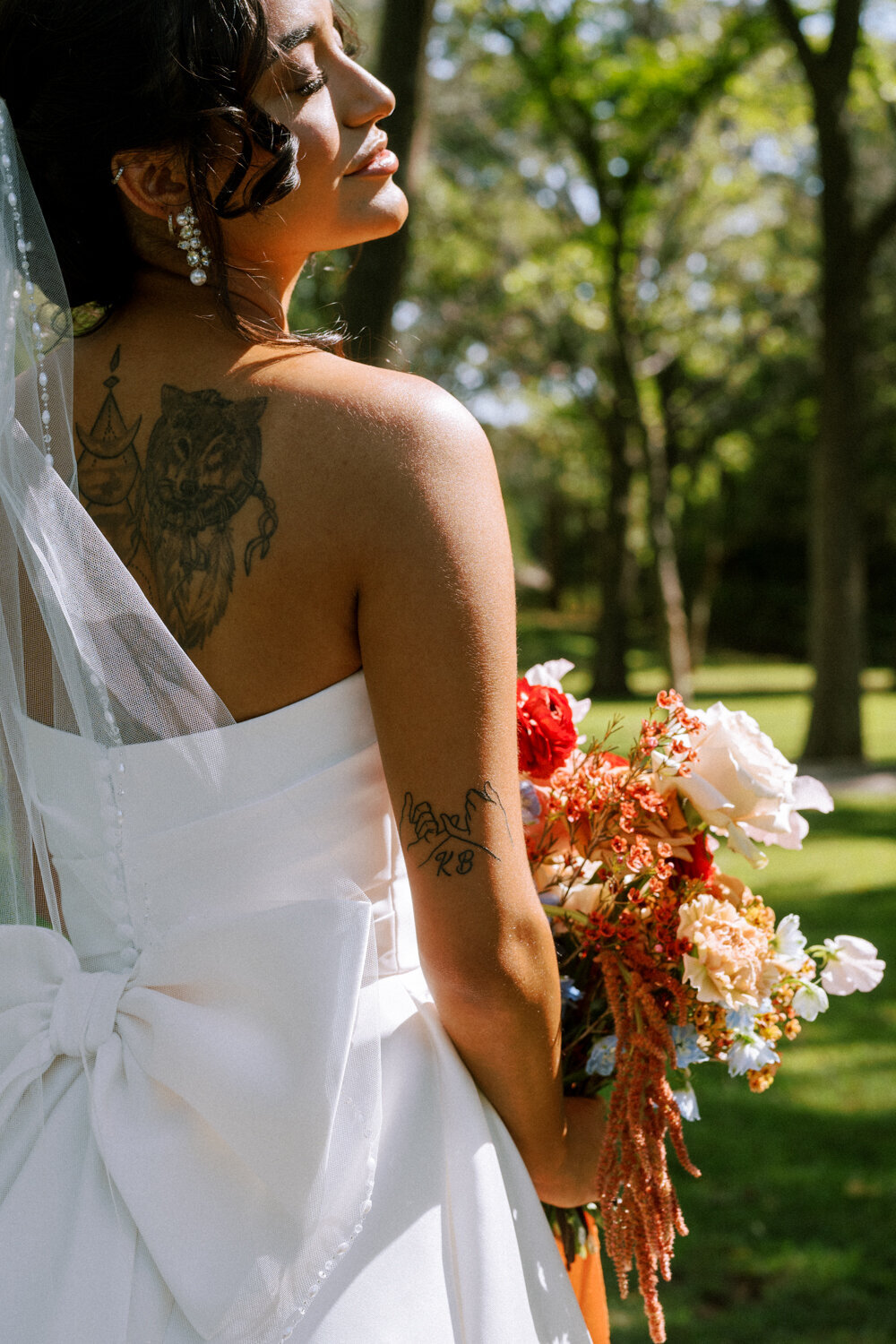 bride-with-sunshine-on-face-and-tattoos