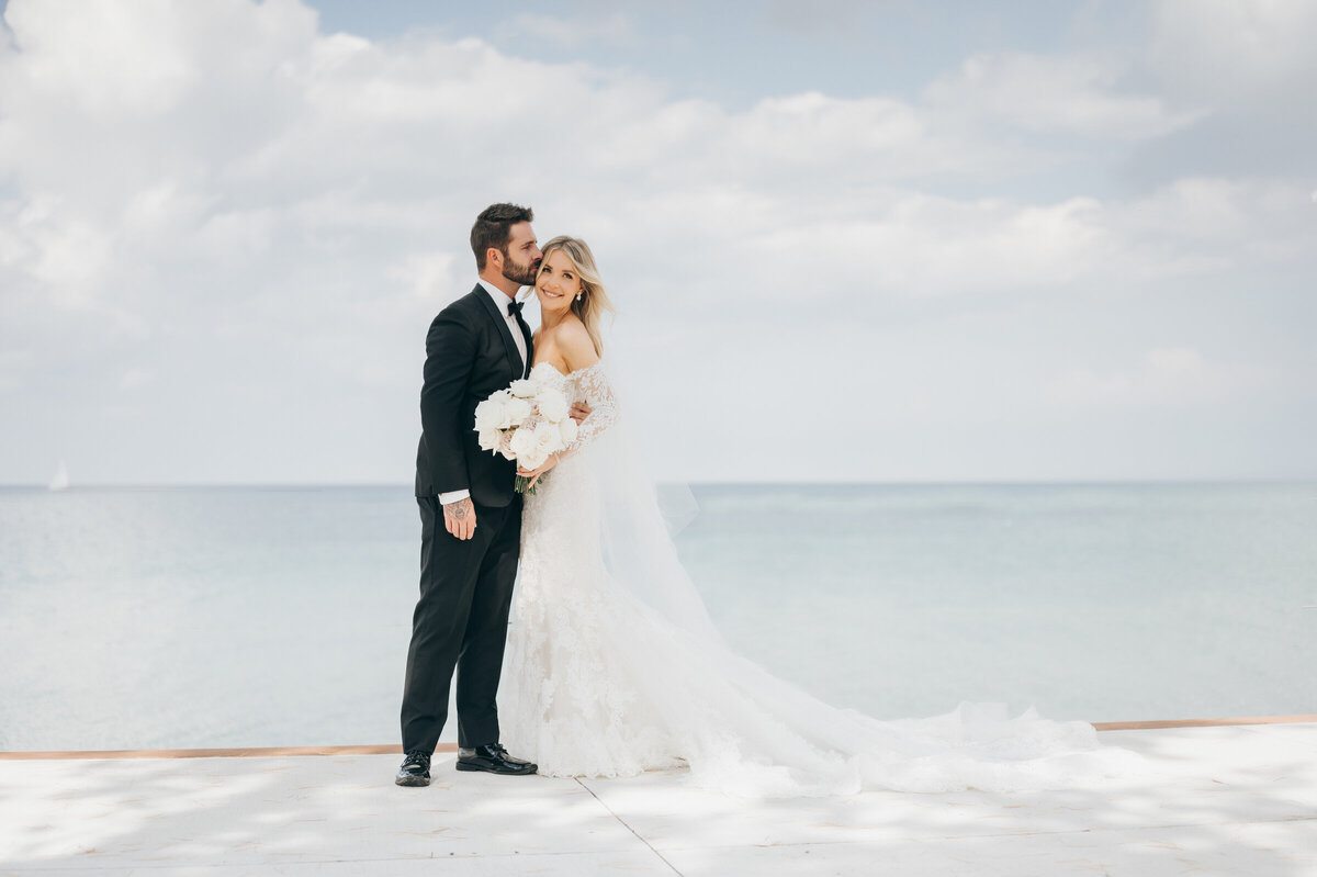 Luxurious bride and groom portraits overlooking the sunny lake