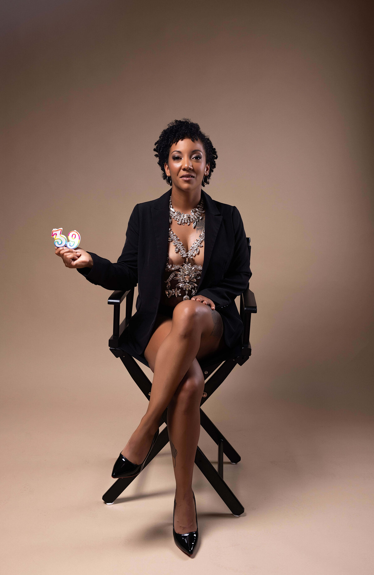 Woman sitting in chair for birthday session with Reva Davis photography