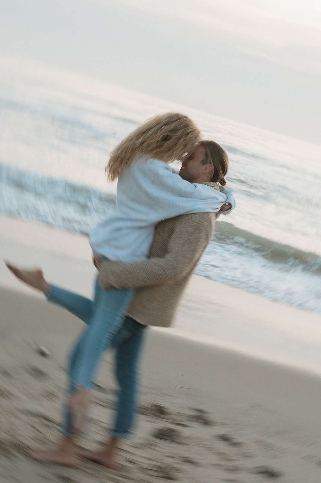 photos of couple on beach in southern california