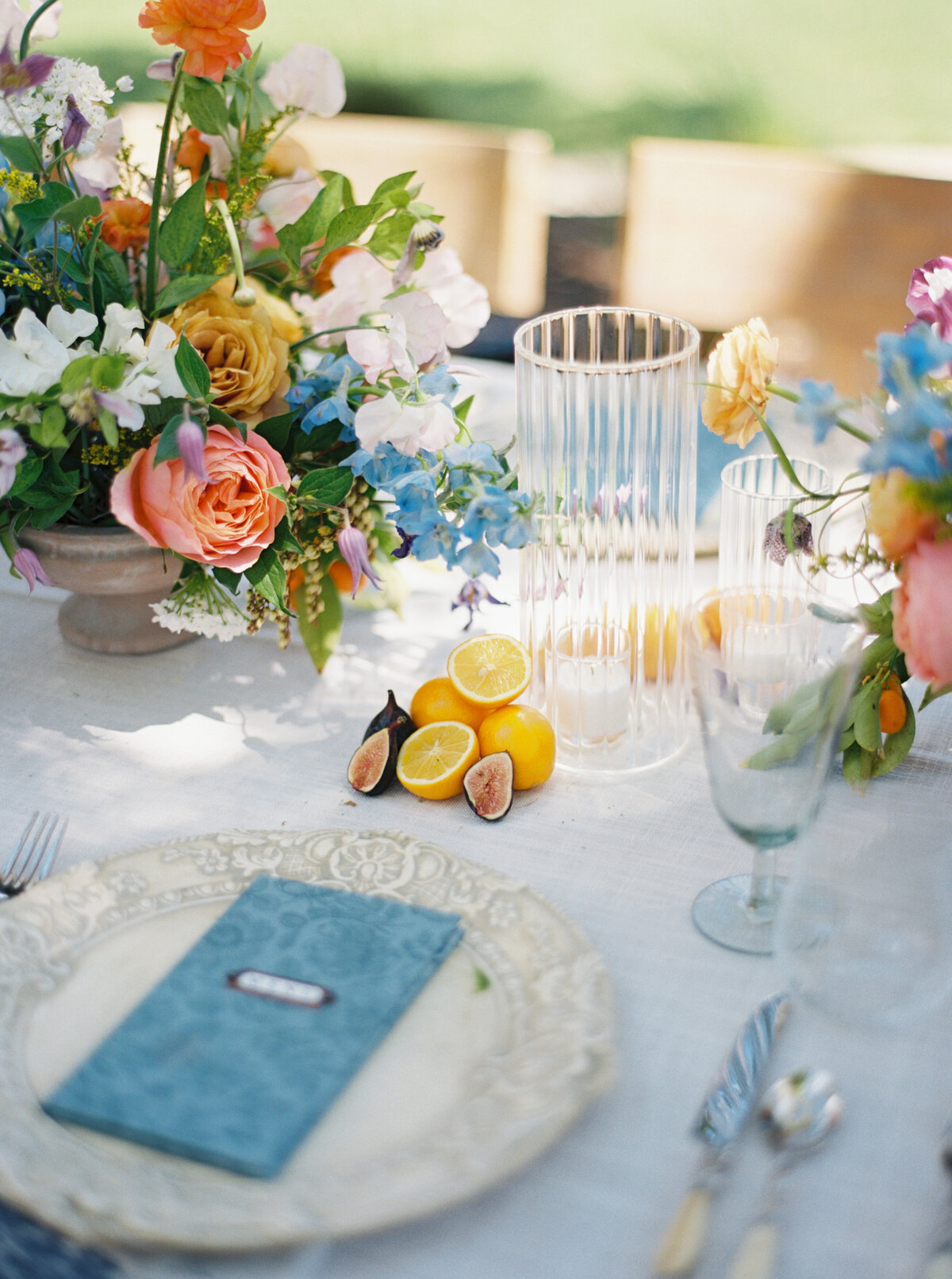 Colorful wedding tablescape featuring vibrant florals and elegant table settings, captured by Morgan Alysse, Lafayette wedding photographer.