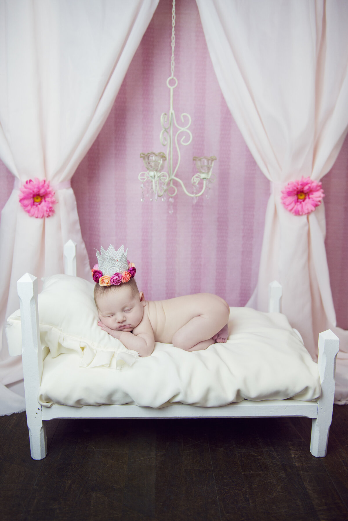 Newborn baby girl in photo studio