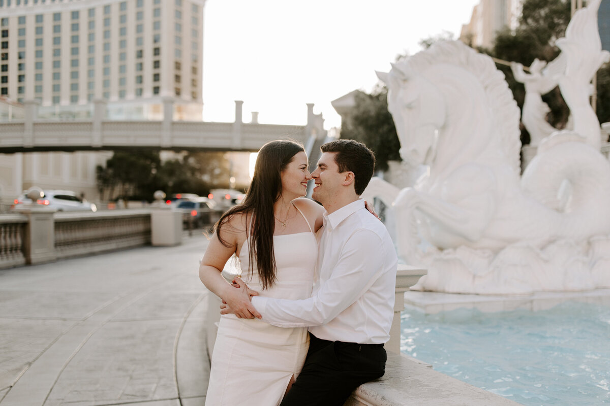 A couple leans in for a kiss on The Strip.