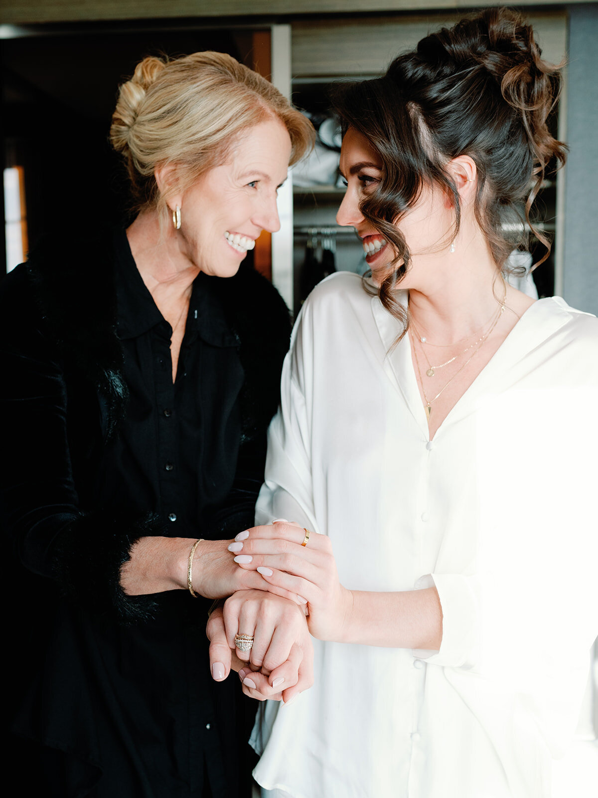 Mom and bride share moment on her wedding day.